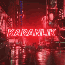 a neon sign that says karanlik in red