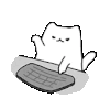 a cat is sitting at a table typing on a keyboard .