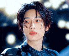 a close up of a person 's face with wet hair and red lips