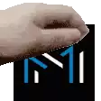 a close up of a hand holding a card with the letter m on it
