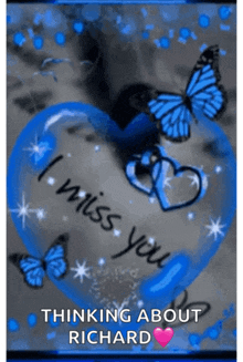 a blue heart with butterflies and the words " i miss you " written on it