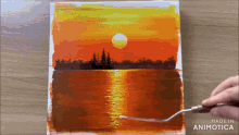 a person is painting a sunset over a lake with a fork