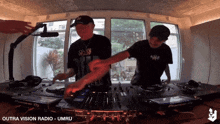 two men are playing music on a pioneer dj set