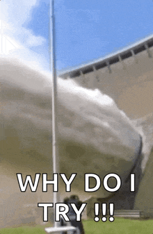 a man is standing in front of a waterfall with the words " why do i try !!! "