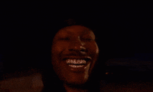 a blurry picture of a person in a dark room with a few lights in the background