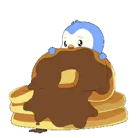 a penguin is sitting on a stack of pancakes with chocolate icing on them