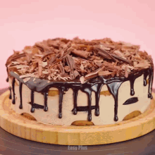 a cake on a wooden cutting board that says easy plus on the bottom