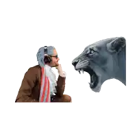 a man wearing headphones looks at a lion