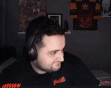 a man wearing headphones and a shirt that says p245
