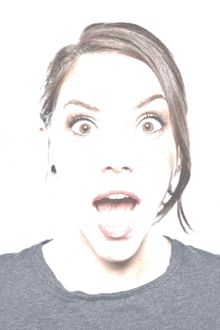 a woman with her tongue out making a surprised face