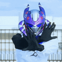 a person wearing a purple helmet with the letter c on the front