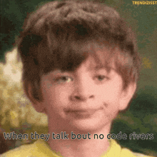 a young boy in a yellow shirt is smiling with the caption when they talk bout no code rivers