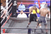 a boxing ring with a tnk sign in the background