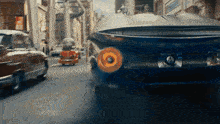a car with the letter o on the front is driving down a street