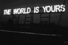 a billboard that says the world is yours on it