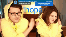 a man and a woman are hugging in front of a screen that says hope on it