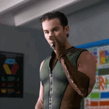 a man in a superhero costume is smoking a cigarette in a classroom