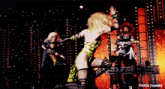 a woman in a leopard print outfit is dancing on a stage with a t4yce tumblr logo in the corner