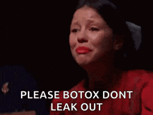 a woman in a red dress is crying and asking for botox .