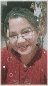 a girl wearing glasses and a red shirt with nivlo on it