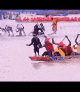a group of people are in a boat with the word dubai on the side
