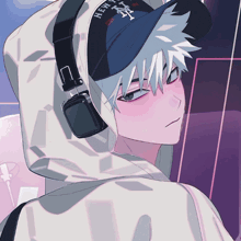 a boy wearing headphones and a new york hat