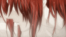 a close up of a person 's red hair with water drops on it