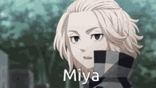 a close up of a person 's face with the word miya on it .
