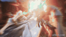 a gif from gifrun.com shows a group of people in a room