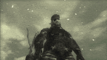 a man in a military uniform stands in the snow