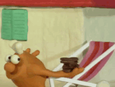a cartoon character is sitting in a beach chair with a stack of cookies