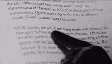 a pink marker is being used to highlight a passage in a book