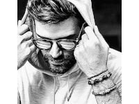 a black and white drawing of a man wearing sunglasses and a hood .