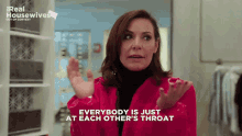 a woman says " everybody is just at each other 's throat " in a red jacket
