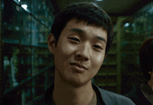 a close up of a man 's face with a smile