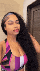 a woman with a tattoo on her head is wearing a purple top with the word gucci on the waistband