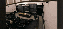 a lecture hall with a chalkboard on the wall that says ' mathematics ' on it