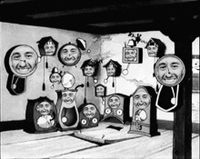 a black and white drawing of clocks with faces on them including one that says ' a ' on it