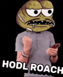 a man with a cartoon face on his head is holding a cell phone and says hodl roach