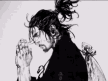 a black and white drawing of a man praying