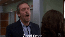 a man in a suit and tie is yelling at a woman and the words good times are visible