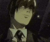a man in a suit and tie is standing in a dark room .