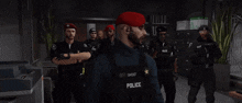 a group of police officers are standing in an office