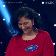 a woman with a name tag that says nancy