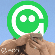 a woman is holding a stack of money in front of a green circle with a smiley face on it