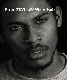 a black and white photo of a man crying with a tear coming out of his nose .