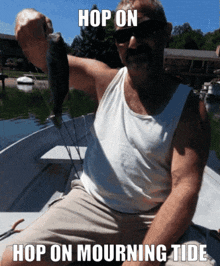 a man in a boat holding a fish that says hop on