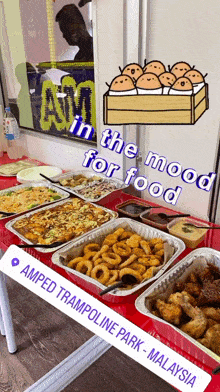 a variety of food is on a table at amped trampoline park