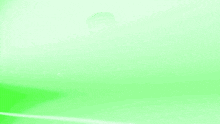 a man in a black shirt is standing in a room with green lights behind him