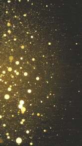 a picture of a kaleidoscope with a black background and gold dots